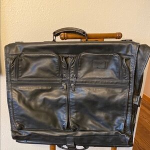 TUMI Black Leather Bi Fold Garment bag with many pockets 24 x 40”